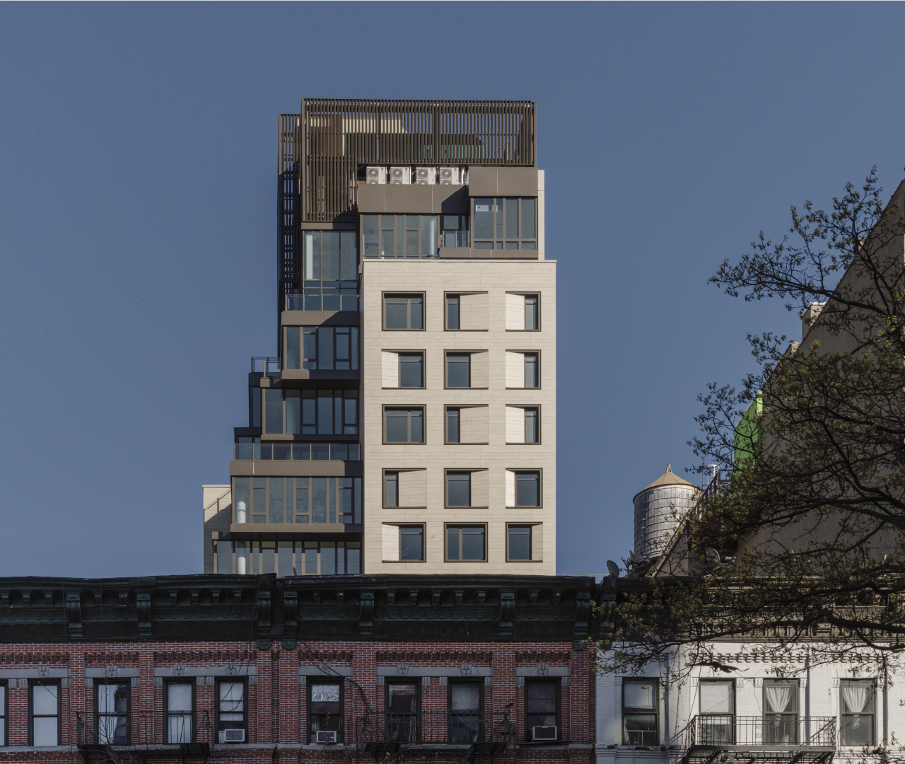 212 West 95 Street Large format porcelain cladding facade tower in contrast with its context