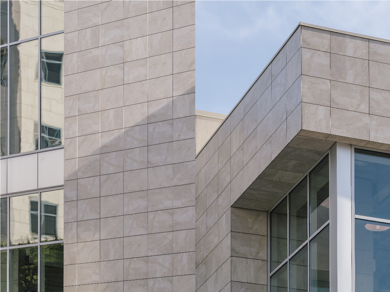 Criterion Building Details Mitered porcelain edge Storefront glass system and Mitered porcelain corner and soffit