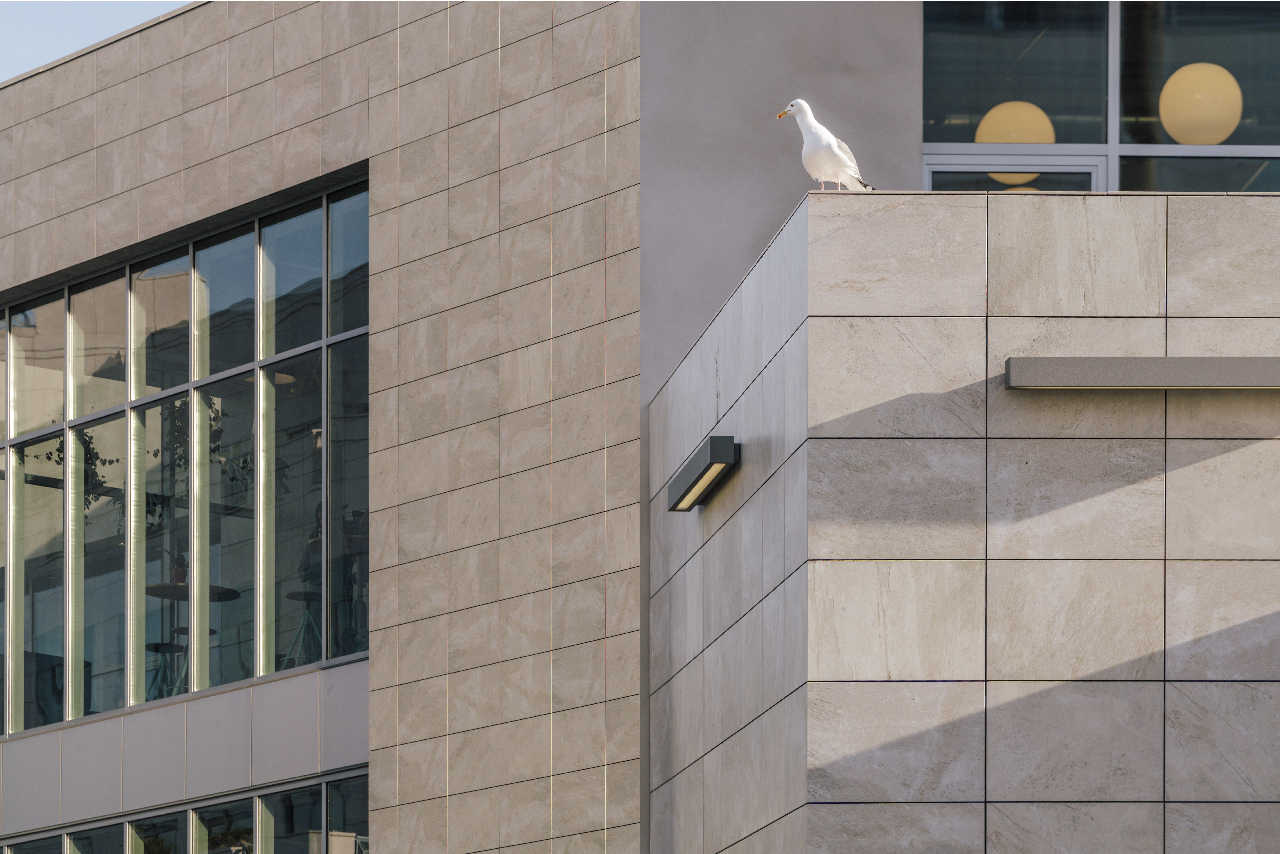 Criterion Building Details Storefront glass with porcelain returns and Porcelain parapet coping application