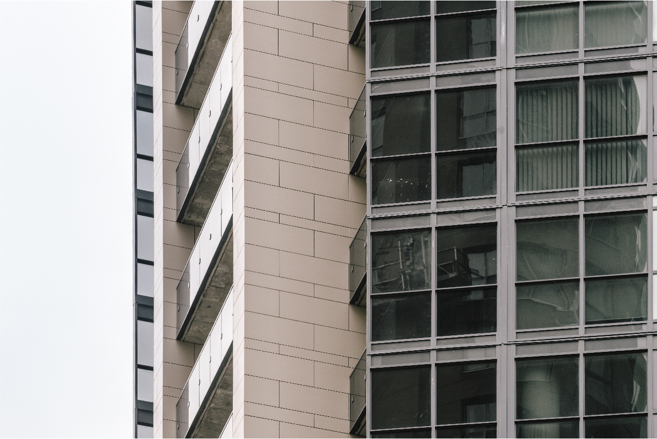 One The Explanade Details of metal and glass railing at porcelain cladding facade