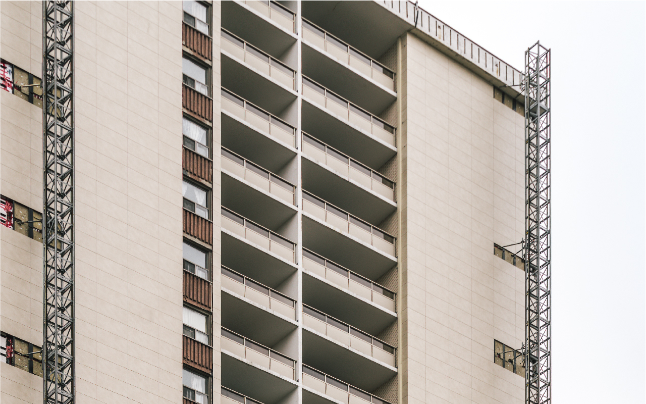 St Claire Apartments Contrasting opaque porcelain panel wall and concrete balconies